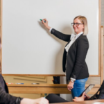 the teacher is giving the lecture in the classroom