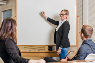 the teacher is giving the lecture in the classroom